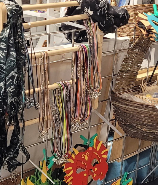 Tiny dinosaur bead on a thong necklace